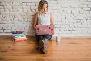 Girl sitting on laptop - tips for social media etiquette