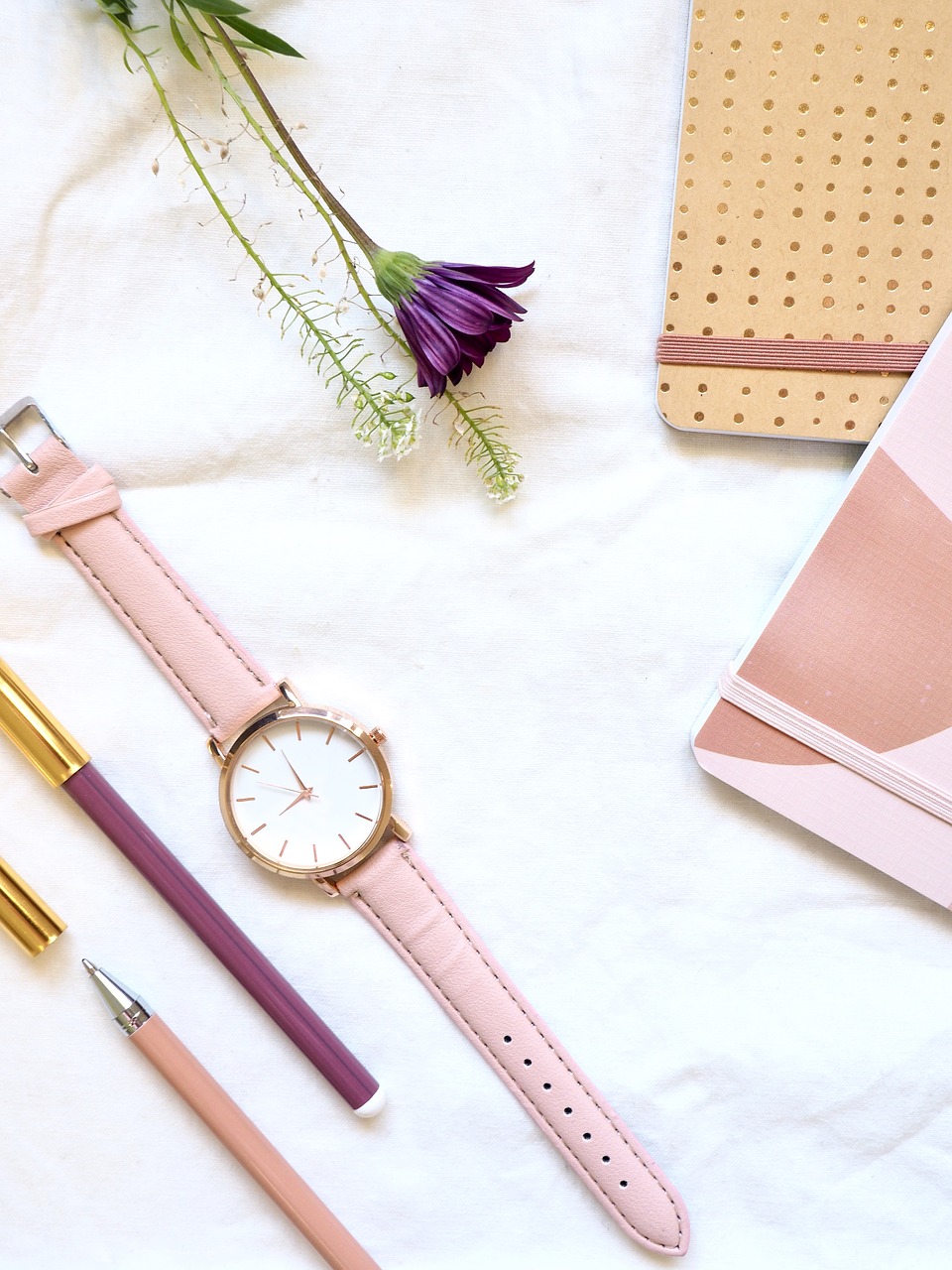 Pink watch and stationery
