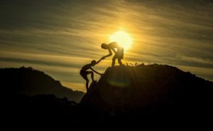 Rockclimbing at sunset - focus on your strength